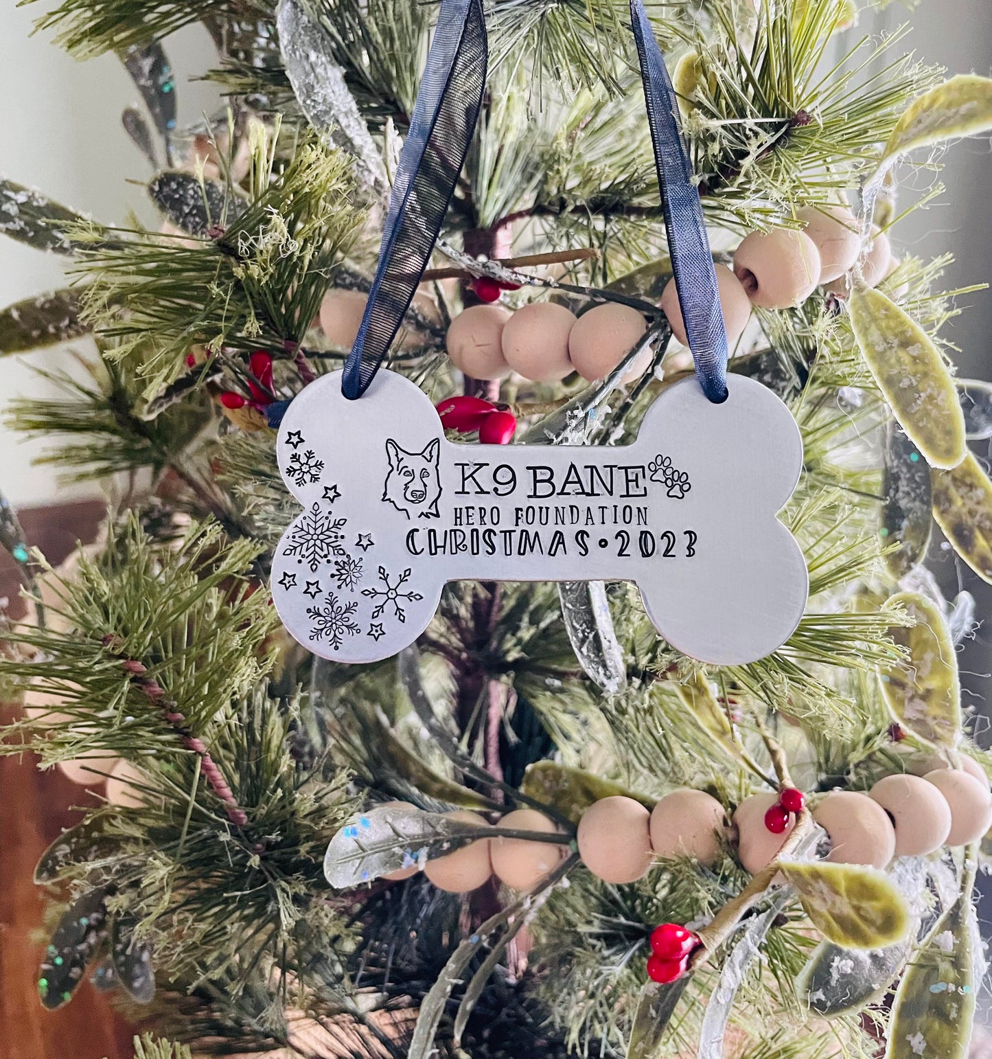 K9 Bane hand stamped dog bone ornament. This ornament will shine bright on your tree this holiday season.