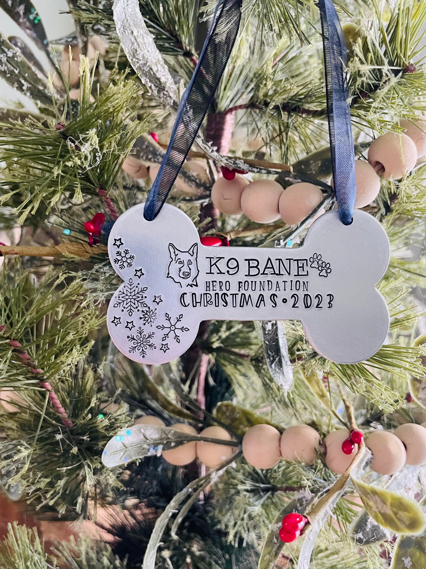K9 Bane hand stamped dog bone ornament. This ornament will shine bright on your tree this holiday season.