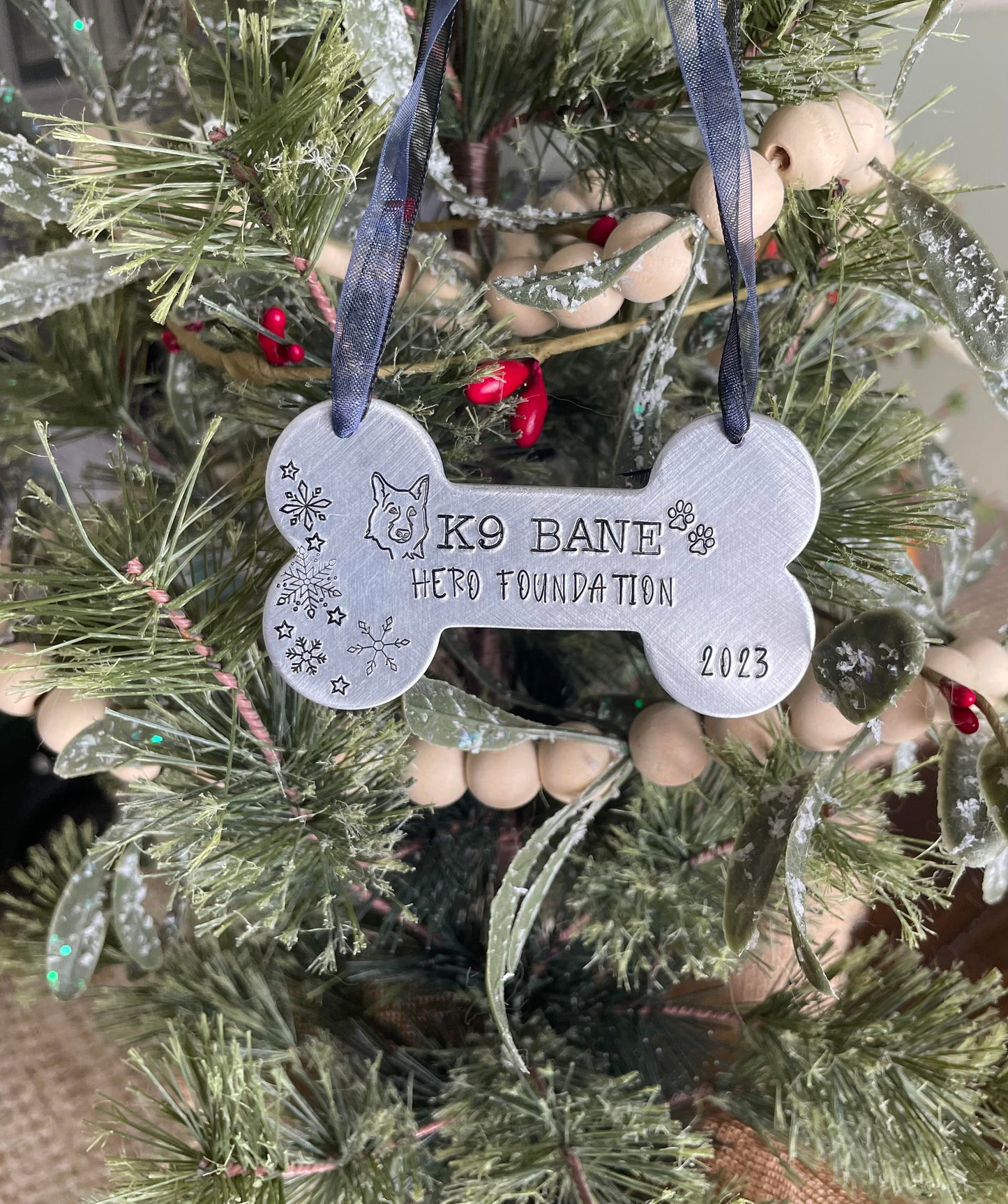K9 Bane hand stamped dog bone ornament. This ornament will shine bright on your tree this holiday season.