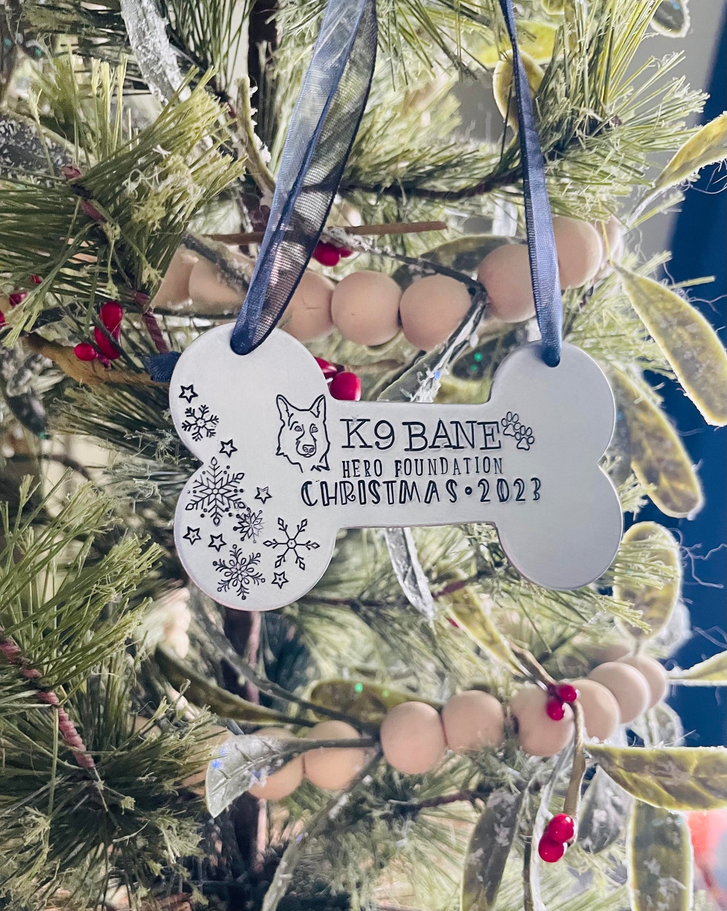 K9 Bane hand stamped dog bone ornament. This ornament will shine bright on your tree this holiday season.