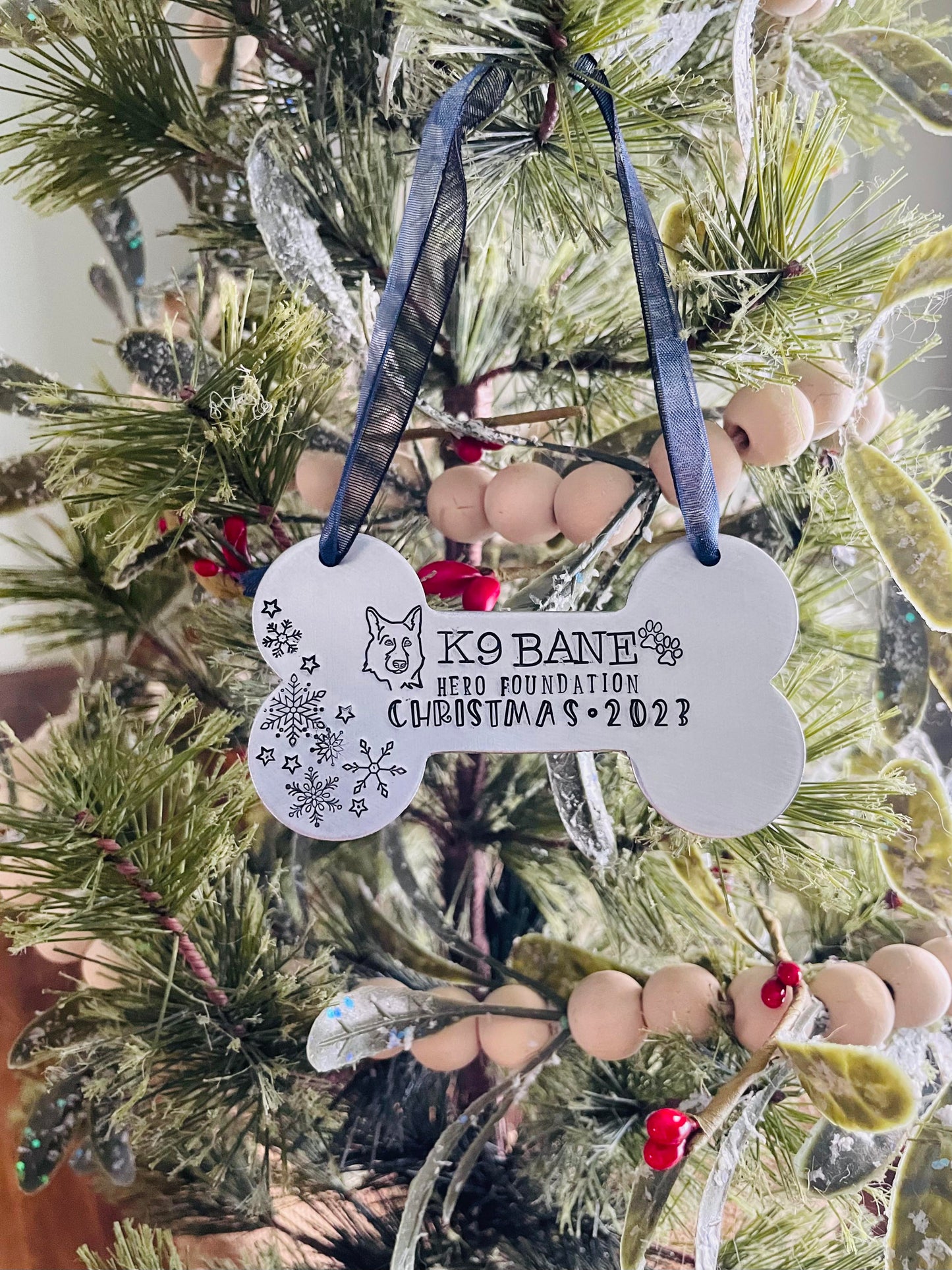 K9 Bane hand stamped dog bone ornament. This ornament will shine bright on your tree this holiday season.