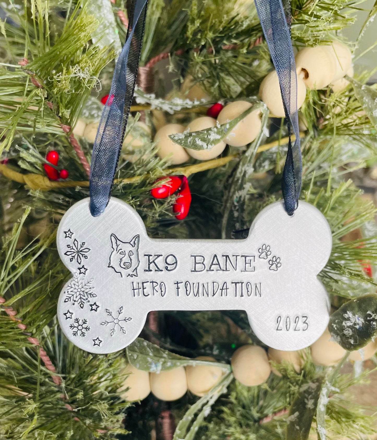 K9 Bane hand stamped dog bone ornament. This ornament will shine bright on your tree this holiday season.