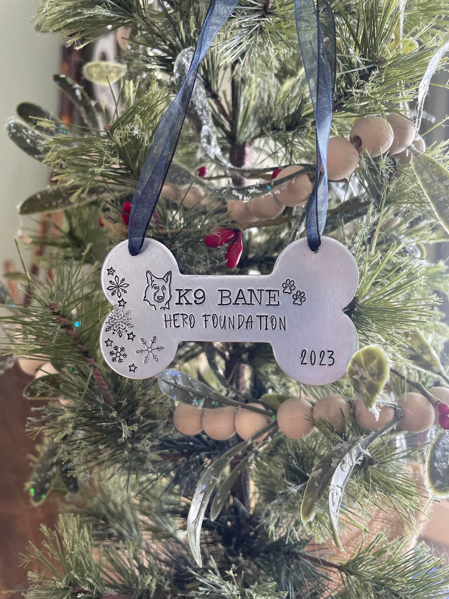 K9 Bane hand stamped dog bone ornament. This ornament will shine bright on your tree this holiday season.